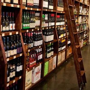a ladder leaning against a wine rack
