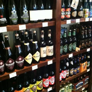 a shelf full of beer bottles