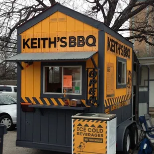 a yellow and black food truck