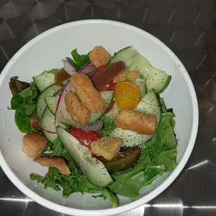 a salad in a white bowl
