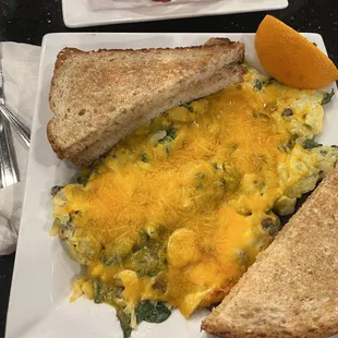 Breakfast bowl with spinach, mushrooms and onions, cheddar cheese with Rye toast