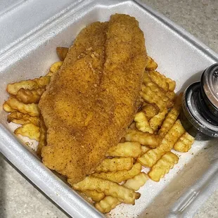 Catfish with fries and a side of the Keland's sauce.