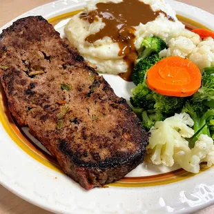 Meatloaf with mashed potatoes and mixed veggies. A customer favorite!