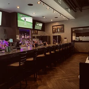 a bar with a lot of bar stools