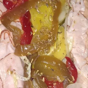 a sandwich with meat and vegetables