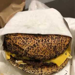 a cheeseburger wrapped in paper
