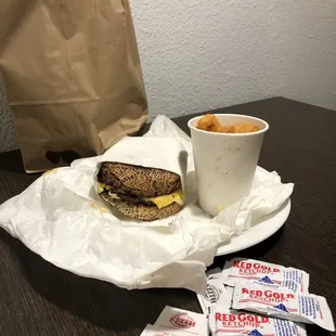 a sandwich and a cup of coffee