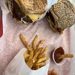 two burgers and french fries