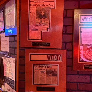 a brick wall with posters on it