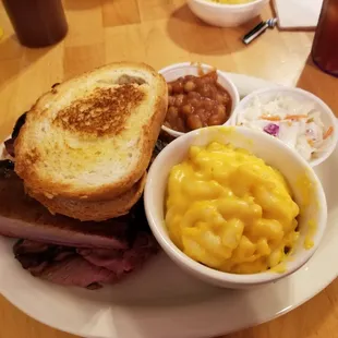 Three Meat Combo. Ribs, Roast Beef, Pulled Pork with Mac-n-cheese, coleslaw, and Baked Beans ($14.99).