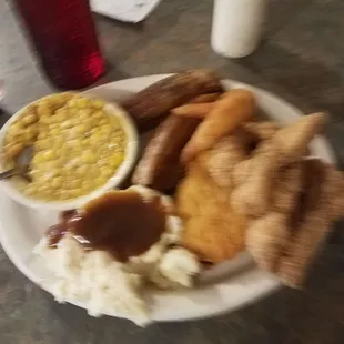 The Big Daddy platter. 5 pieces of fish, 2 big chicken tenders, 5 pieces of fried shrimp, 2 huge potato wedges, corn, and mashed potatoes.