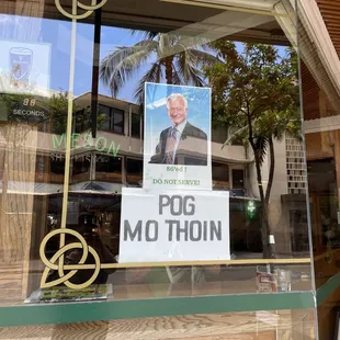 a political poster in a window