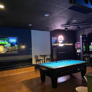 Pool room with Golden Tee, Bowling, and a dart board!