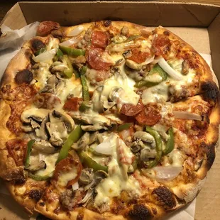 The deluxe or combo small pizza.