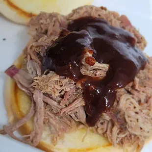 Pulled pork sandwich with spicy BBQ sauce.