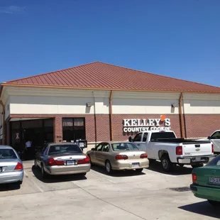  cars parked in front of the store