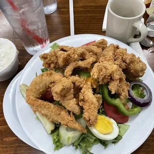 Salad with fried chicken tenders.