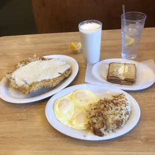 Super Texas Size Chicken Fried Steak, eggs and hash browns and toast