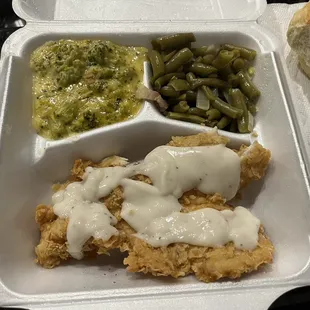 Chicken fried chicken with cream gravy, broccoli casserole, green beans, dinner roll