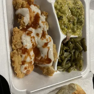 Chicken fried chicken with cream gravy and added Louisiana hot sauce