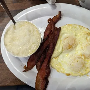 a plate of eggs and bacon