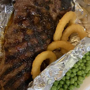 a steak and french fries on a plate