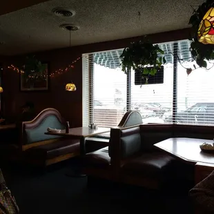 a dining area with couches and tables