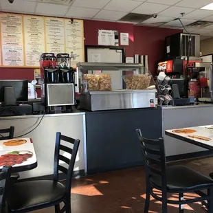 Seven tables in the small eating area