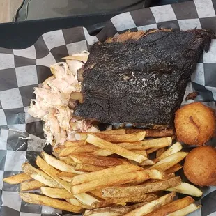 Awesome ribs and pulled chicken.   Picture is missing the corn