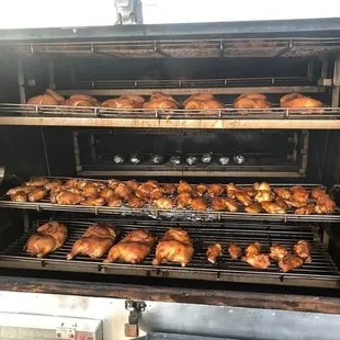 chicken cooking in a smoker