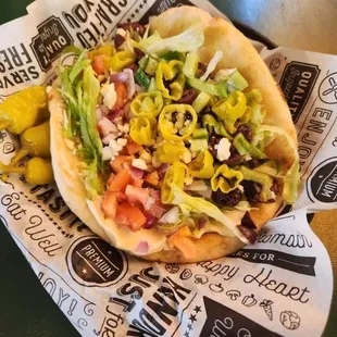 Veggie Gyro
Pita topped w/ hummus, tzatziki sauce, feta, lettuce, tomatoes, onions, diced cucumbers, kalamata olives, &amp; pepperoncinis