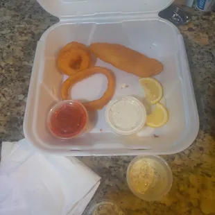 a meal in a styrofoam container