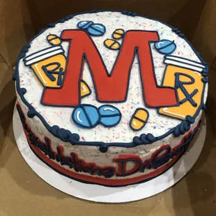 a cake with the letter m on it