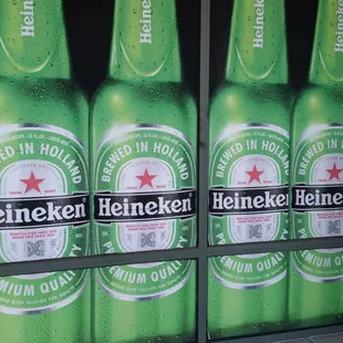 heineken bottles in a store window
