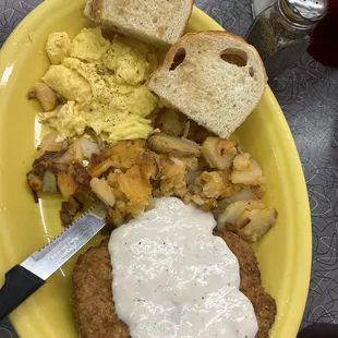 Country Fried Steak with potatoes and scrambled eggs.
