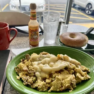 Breakfast scramble with pepper Jack cheese on top and bagel &amp; cream cheese