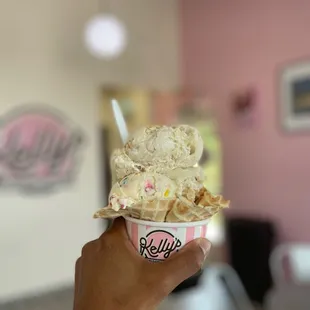 Triple scoop ice cream in a waffle cup