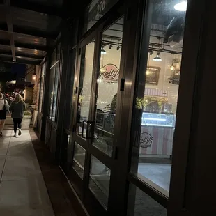 people walking down the sidewalk