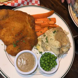 Crispy Chicken with mashed potatoes, glazed carrots and peas
