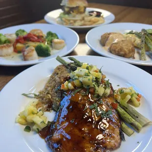 Soy glazed salmon, sea scallops, smash burger, crab cakes