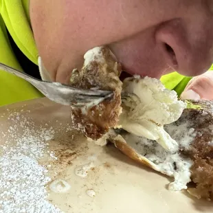 a person eating a doughnut