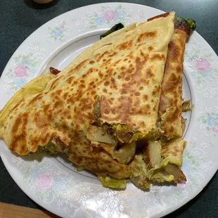 Savory Crepe!  Pesto, potato, spinach, onion, turkey Mozzarella and egg.