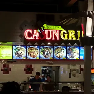 a neon sign for cajun's