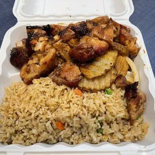 Bourbon Chicken, cajun potatoes, and fried rice