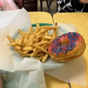Half portion of large french fries and donut