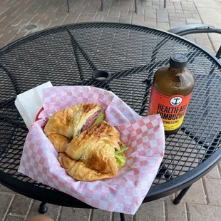 a croissant sandwich on a table