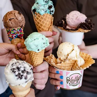 a group of people holding ice cream cones