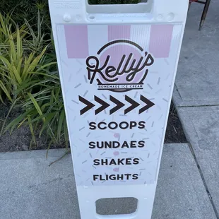 a sign on the sidewalk