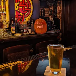 a glass of beer on the bar