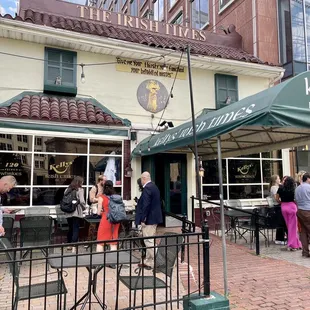 people standing outside of a restaurant